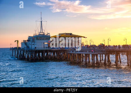 May 27, 2017.  Santa Monica, California.   Tourists visiting Santa Monica Pier in California at sunset on the west coast. Stock Photo