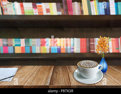 Many books on bookshelf in library - blurred background Stock Photo