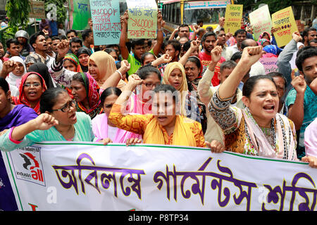 Dhaka, Bangladesh - July 13, 2018: Bangladeshi garment workers form a protest rally in front of the National Press Club on Friday demanding BDT 16,000 as the monthly minimum wage. Stock Photo