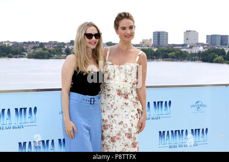 Amanda Seyfried and Lily James during the 'Mamma Mia! Here we go again' photocall at The Fontenay Hotel on July 12, 2018 in Hamburg, Germany. Stock Photo