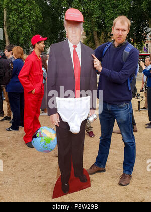 Parliament Square. London. UK 13 July 2018 - The 'Trump baby' blimp in Parliament Square as US President Donald Trump continues his four days visit to the United Kingdom.  Credit Roamwithrakhee /Alamy Live News Stock Photo