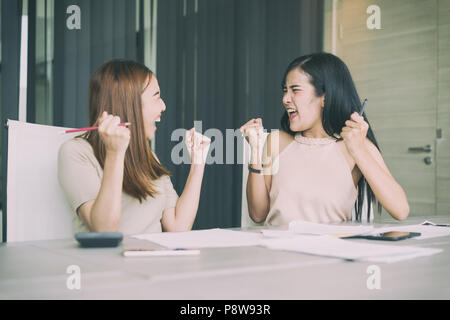 Asian businesswoman with casual suit working with happy action in office Business people concept. Stock Photo
