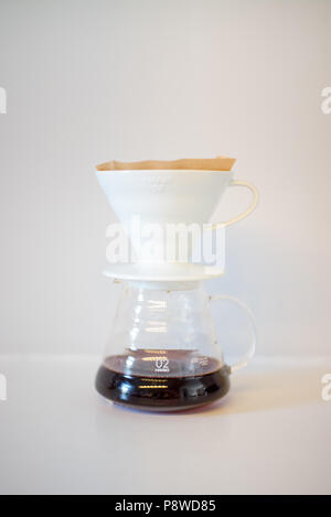 v60 pour over brewing method.  Filter coffee paper.  Drip coffee.  Coffee at home. Stock Photo