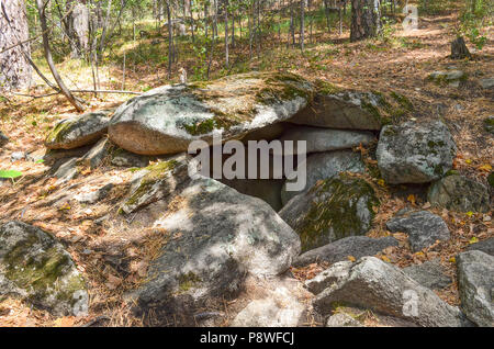 Ancient dolmen of the Neolithic age in the southern Urals. Megalithic structures on Island of Vera on Turgoyak Lake. Stock Photo