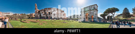 Italy, Rome, March 9/ 2018, tourists walking around the Arch of Constantine and Colosseum Stock Photo