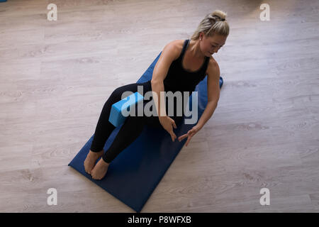 Woman performing stretching exercise Stock Photo