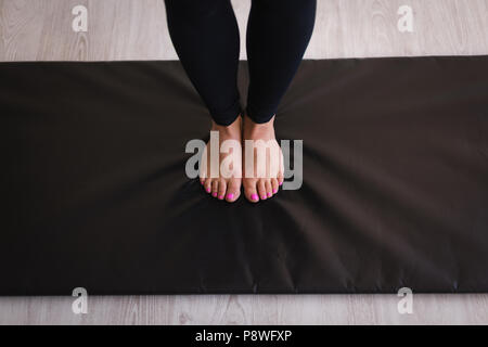 Woman performing stretching exercise Stock Photo