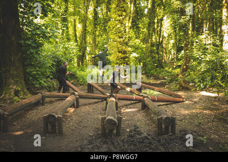 Fit mens training over obstacle course Stock Photo
