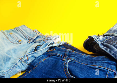 jeans on a yellow background. fashion and style.place for text. Stock Photo