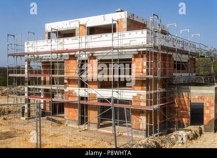 Shell in massive construction in a development area | usage worldwide Stock Photo