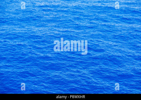 Vast blue ocean background with moderate waves Stock Photo