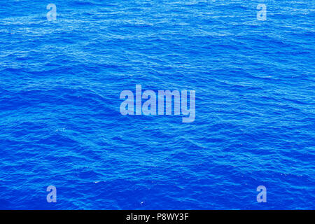 Vast blue ocean background with moderate waves Stock Photo