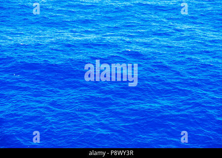 Vast blue ocean background with moderate waves Stock Photo