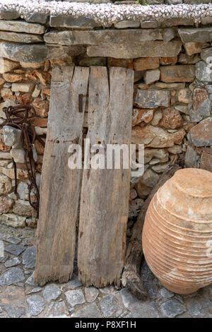 Old wooden door at Koumos Stone House and restaurant at Kalyves Crete Stock Photo