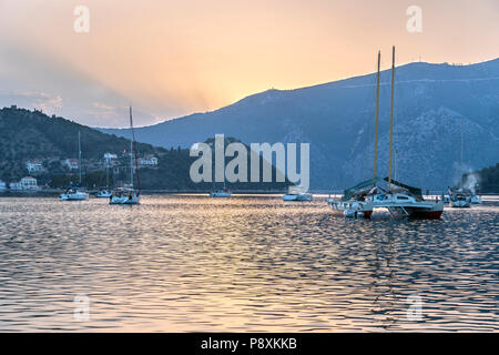 Yachts moored in Vathy harbour at sunset. On the island of Ithaca, Ionian Sea, Greece Stock Photo