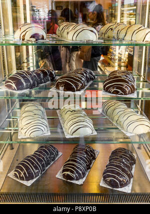 A local versions of Tsoureki, Easter bread, a brioche bread covered in icing. in a shop window in, Thessaloniki Macedonia, Northern Greece Stock Photo
