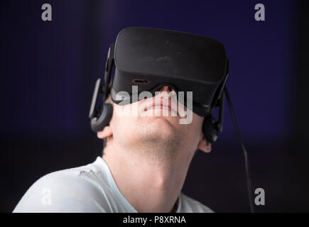 Young man using a virtual reality headset Stock Photo