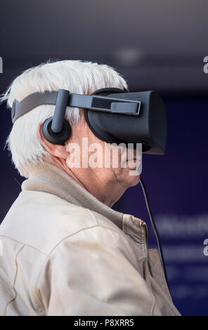 Senior man using a virtual reality headset Stock Photo