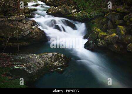 High contrast, wide format, long-exposure cascade along the Middle Prong Trail in the Great Smoky Mountain National Park. Stock Photo