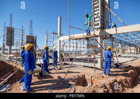 Construction workers   on an outdoor construction site Stock Photo