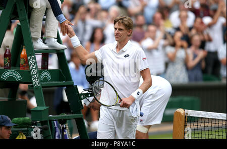 South African eighth seed Kevin Anderson celebrates having reached his first Wimbledon final, beating American ninth seed John Isner 7-6 (8/6) 6-7 (5/7) 6-7 (9/11) 6-4 26-24 in the longest semi-final in the tournament's history on day eleven of the Wimbledon Championships at the All England Lawn tennis and Croquet Club, Wimbledon. PRESS ASSOCIATION Photo. Picture date: Friday July 13, 2018. See PA story tennis Wimbledon. Photo credit should read: Steven Paston/PA Wire. RESTRICTIONS: Editorial use only. No commercial use without prior written consent of the AELTC. Still image use only - no mo Stock Photo