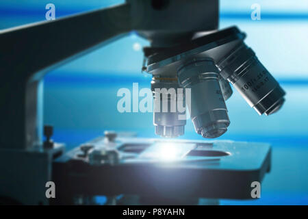 Microscope stage and lenses. Stock Photo