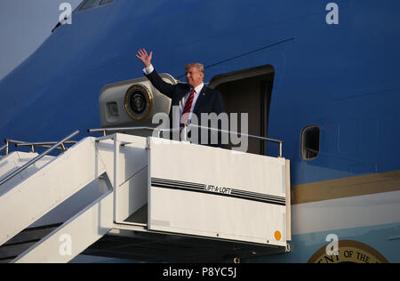 US President Donald Trump waves as he arrives on Air Force One at Prestwick airport in Ayrshire, en route for Turnberry, where they are expected to stay over the weekend. Stock Photo