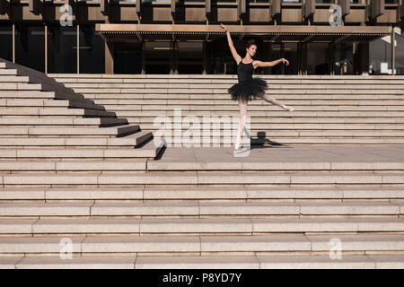 Woman performing ballet on the steps Stock Photo