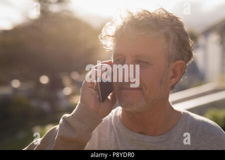 Senior man talking on mobile phone Stock Photo