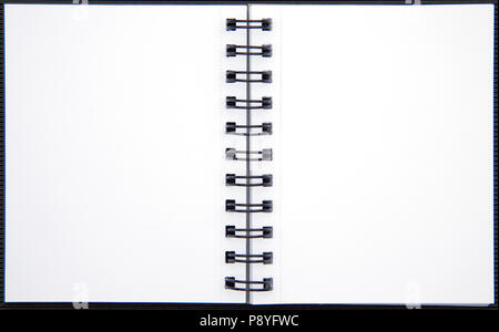 Open two white pages notebook with metallic spiral. Copy space with blank opened page organizer isolated on white Stock Photo
