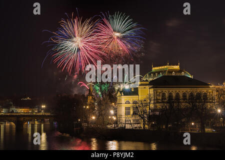 New Year Prague fireworks 2018 over river Vltava, National Theater and historic architecture.