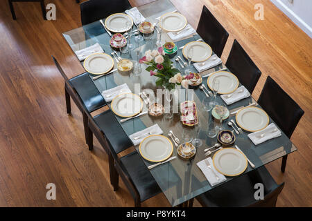 High Angle View of Dining Room Table with Place settings Stock Photo