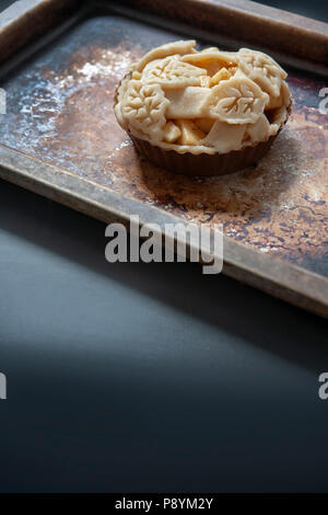 Mini Apple Pie on Baking Sheet Stock Photo