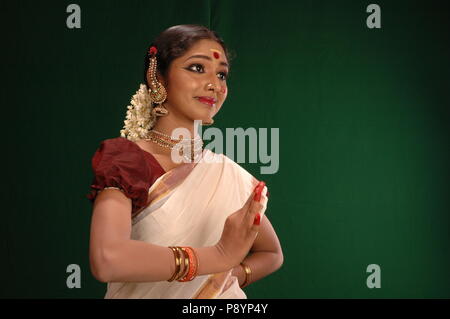 mohiniyattam is one of the eight classical dance forms of india,from the state of kerala.it is distinct for the graceful body movements Stock Photo