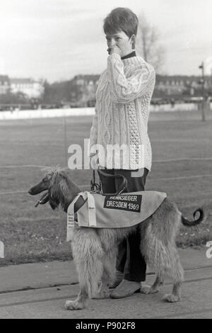 Dresden, GDR, proud owner of an Afghan hound, winner of a Greyhound race on the former cycle track Johannstadt Stock Photo