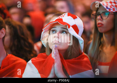 ZAGREB, CROATIA - JULY 11, 2018 : Croatian football woman fan all worried watching the match of Croatia vs England semi finale Fifa World cup 2018 on  Stock Photo