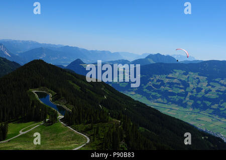 Austria: Paragliding around 'Spieljoch' mountain above Hochfügen in Tirol Stock Photo