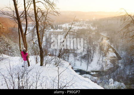 Little girl admiring a view of Vilnia river from geological Puckoriai exposure in Vilnius, the highest exposure in Lithuania Stock Photo