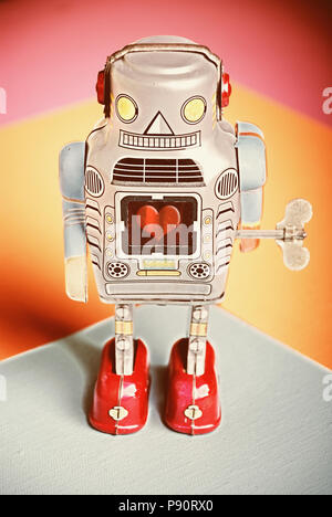Vintage Toy Tin Windup Robot with heart symbol in center Stock Photo