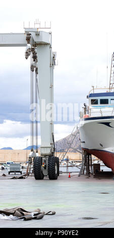 big crane in the harbor yacht area for moving the boats Stock Photo