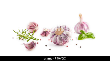 Garlic Cloves and Bulbs with rosemary and pepper isolated on white. Stock Photo