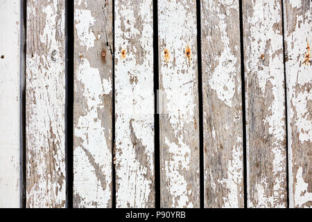 Overhead of rustic wooden planks with worn white paint for background backdrop use Stock Photo