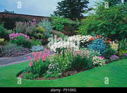 Pink and white flower bed at country garden Stock Photo