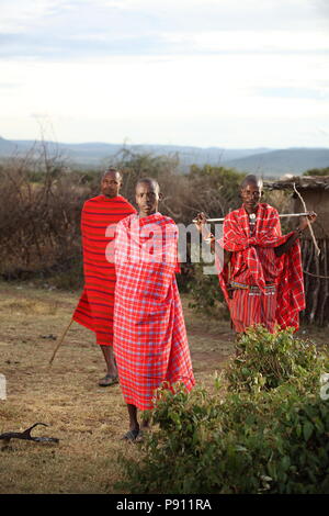 Maasai traditional men in traditional Maasai red dress smiling portrait Stock Photo