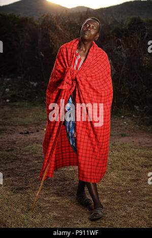 Masai warrior traditional Masai Man dressed in red  Elephant skull hunter, Masai hunter Stock Photo