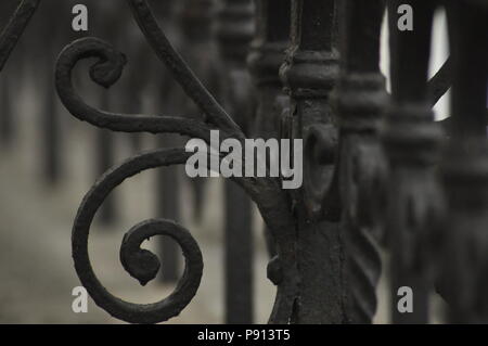 cast iron fence painted black Stock Photo