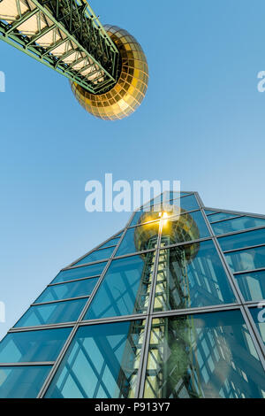 Reflection in a glass builidng of the Sun Sphere tower in Knoxville Stock Photo