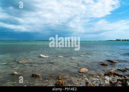 Storm clouds coming across the bay make it look very ominous. Stock Photo
