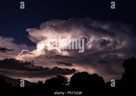 Dramatic lightning storm illuminates nighttime sky; Salida; Colorado; USA
