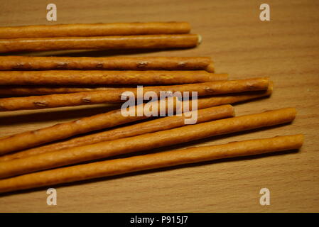 Food, fresh sweet straws on a brown matte background. Stock Photo